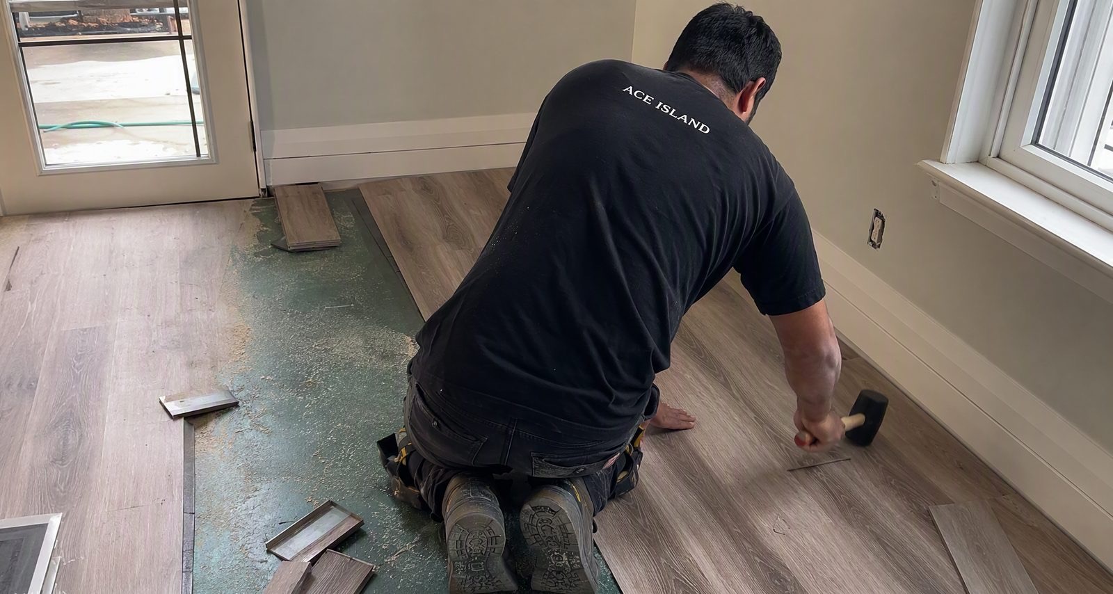 An Ace Island Flooring installer laying luxury vinyl plank in a Vancouver Island home
